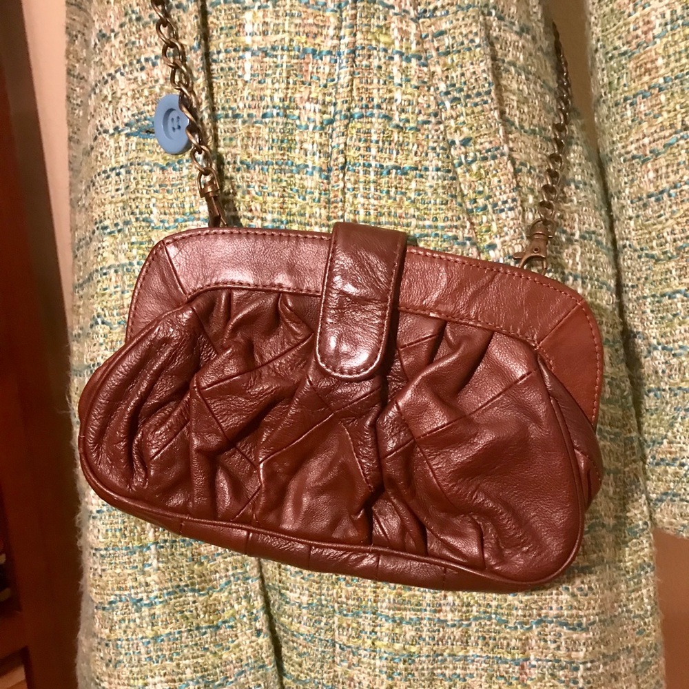 Brown leather clutch with shoulder chain